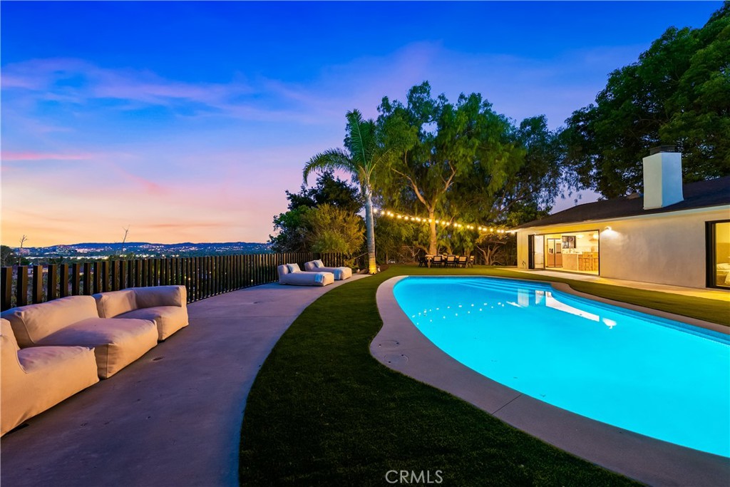 Located in one of the most sought-after neighborhoods in West Hills, this beautifully updated home offers a perfect mix of modern style, smart design, and incredible valley views. It’s in a top-rated school district, giving you not just a great location but also a comfortable and stylish place to call home.
The entire house has been redone from top to bottom with care and attention to detail. The kitchen is the heart of the home, combining beauty and function with sleek finishes, high-end fixtures, and a stunning 12-foot accordion glass door that opens to the backyard. This seamless indoor-outdoor flow fills the space with light and makes entertaining a breeze. The exterior has fresh, smooth stucco with custom rock accents, and the fully finished garage features a designer door that adds to the home’s curb appeal.
Inside, every bathroom is brand new with modern fixtures and tasteful touches. The new flooring throughout creates a clean, cohesive feel. The backyard has been completely reimagined for both relaxation and fun, with a resurfaced pool, upgraded hardscape, and open spaces that are perfectly positioned to take in breathtaking sunsets over the valley.
This isn’t just a remodel, it’s a full transformation. With thoughtful upgrades, quality craftsmanship, and a design you won’t find anywhere else, this home truly stands out. Don’t miss the chance to make it your own.