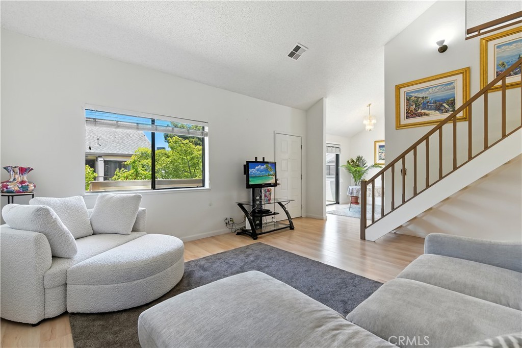Discover this beautiful top-level corner condo in the desirable Walnut Place community! Featuring 2 bedrooms, 2 full baths, and a versatile upstairs loft for an office, playroom, or guest room. When you walk in, you'll be greeted by a living room with stunning cathedral-style high vaulted ceilings. The master suite features soaring ceilings, a private en-suite, and a walk-in closet, while the attached huge 2-car garage and in-unit laundry add ultimate convenience. Enjoy sunny days on your private patio or take advantage of community amenities, including a pool and volleyball court. Ideally located, you're just a short walk from BART, hospitals, parks, golf/tennis courts, a library, and fantastic shopping and dining, with easy freeway access. This is the perfect blend of comfort and convenience – don’t miss it!