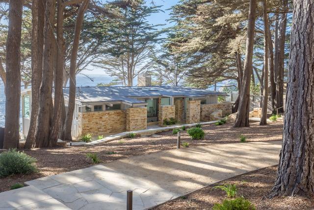 "Misty" the Errol Garner song that was featured in the movie "Play Misty for Me". This spectacular property was the setting for the final scene in the movie. Perched on the cliff above the wild and beautiful Carmel coast, this 1.25-acre compound features a completely remodeled three-bedroom, three-bath residence and one-bedroom guest house. From the living room, kitchen, and two of the bedrooms, you can see the ocean in all of its moods. The turquoise and blue water crashing on the rocks below add drama to this serene property, which is completely fenced and private. Contemporary in style but warm in atmosphere, there are fireplaces in both the main residence and the guest house with a chefs "galley style" kitchen in the main residence. A truly unique and beautiful property in a very exclusive part of the Carmel coast. There are few homes that afford this kind of view and setting this close to the ocean!