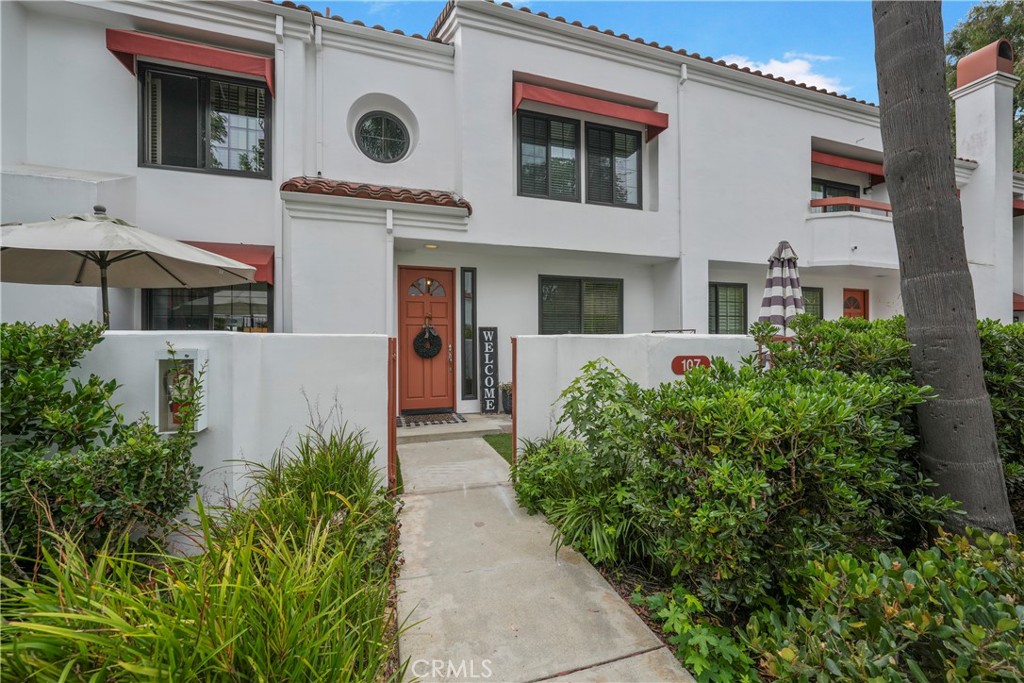 Welcome to 19581 Pompano Lane #107, a stunning tri-level “Capri Plan” townhome located in the highly desirable guard-gated community of Pacific Ranch in Huntington Beach. This move-in ready 2,125sf home offers 3-bedrooms and 2.5 bathrooms, tastefully upgraded with fresh paint and new flooring throughout. The kitchen, featuring modern finishes flows into the spacious living room, which includes a cozy fireplace and sliding doors leading to your private, enclosed balcony. Upstairs, you’ll find two bedrooms, each with their own en-suite bathrooms. The primary suite boasts a sitting/exercise area and the en-suite bathroom has dual sinks and a large walk-in closet. This floor plan will continue to inspire you as you descend to the lower level you’ll notice the large laundry/utility room with the adjacent bedroom that offers versatility as a third bedroom, a guest room, a home office or as a bonus/game room, the possibilities are endless. This townhome includes an attached two-car garage with an automatic garage door and direct access to the home. This perfectly located home within the extremely well-maintained Pacific Ranch is known for its lush landscaping, multiple pools and spas, and prime location next to the world-famous Main Street, which hosts the annual 4th of July parade and just a mile and a half from the beach and Pacific City, which offers excellent shopping and restaurants. This exceptional property offers the perfect blend of comfort, style, and coastal living.