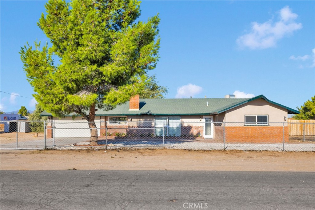 This beautifully remodeled 4-bedroom, 2-bathroom home offers 1,731 sq. ft. of living space on a sprawling 20,680 sq. ft. corner lot zoned for horses. Bring your animals, RVs, boats, trailers—there’s space for it all, with plenty of room to add corrals, RV hookups, and more. The property is fully gated and comes with two convenient storage sheds.
Step inside and you’ll fall in love with the ambient fireplace and elegant mantle—the true heart of the home. The spacious great room is framed by large windows that flood the home with natural light, creating a warm and inviting atmosphere.
The split floor plan gives the master bedroom privacy on one side of the home, while the other three bedrooms sit comfortably on the other side. The backyard features a cozy private courtyard and endless opportunities to create your dream outdoor space—whether it’s a garden, chicken coop, or a personal retreat.
This home has been completely remodeled; New granite countertops, Fresh interior paint and hardwood flooring, New tile, carpet, and recessed lighting, Upgraded light fixtures, Dual-pane windows for efficiency.
Don’t wait—homes like this, with land, horse zoning, and a modern remodel, are rare and don’t stay on the market long. Schedule your private showing today and make 12416 Tonikan Rd your new Apple Valley retreat before it’s gone!