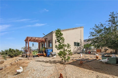 Photo of 10392 Cima Mesa Road, Juniper Hills, CA 93543 (MLS # GD26201077)
