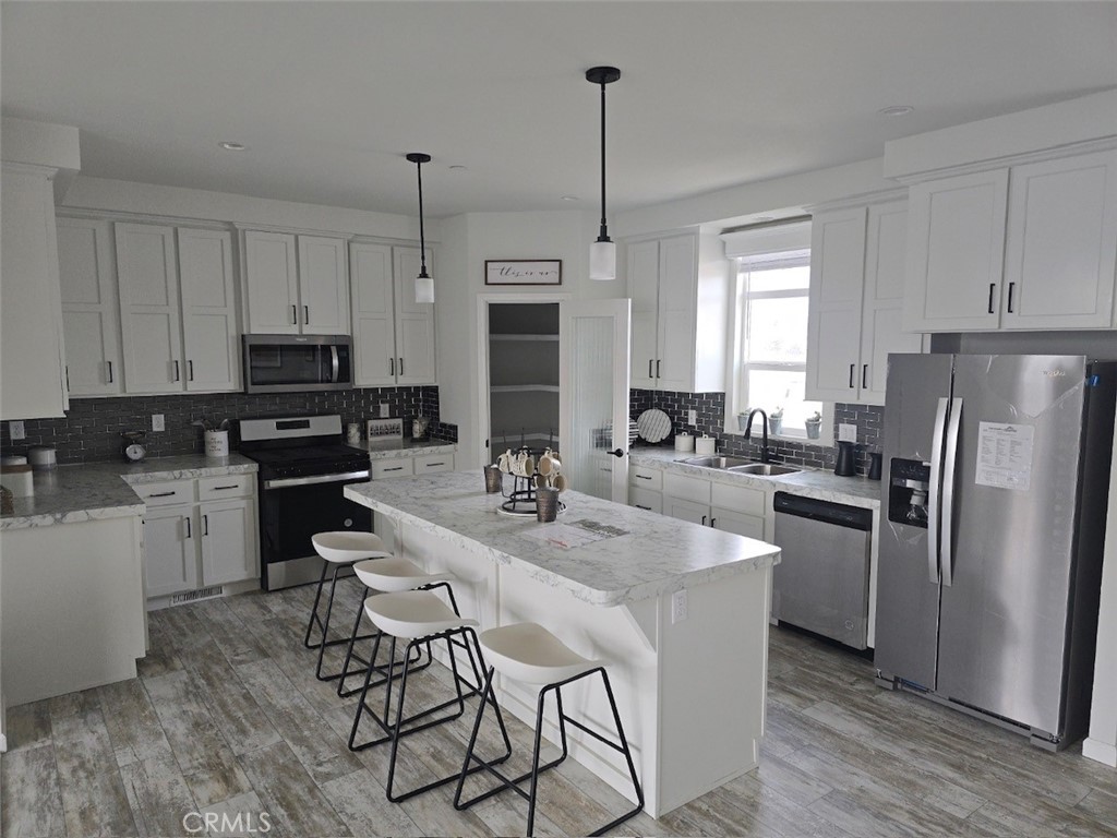 INCREDIBLY LOW SPACE RENT (only $800 per month).Brand New Architectural sprawling 4 bed 2 bath manufactured home. Near 10 foot flat ceiling through entire home. Entire home encircled will upper windows just below roof line. Split floor plan, bedrooms separated by 30 feet for privacy. Has a open floor plan with a Gorgeous kitchen with large chefs island, soft closing cabinets and soft closing drawers And a incredible walk in pantry. Spacious dining room for large family gatherings. The Elegant living room, bathed in light. Additional 3 bedrooms and 1 baths on opposite end of home from a huge master bedroom with walk in closet and spa like bathroom. Huge covered porch, perfect for relaxation and entertainment. The home comes with a large enclosed side yard as well as 3 car covered parking. The community has a nice clubhouse, beautiful pool and modern gym. This community is gated, quiet and safe location. ALL AGE COMMUNITY with INCREDIBLY LOW SPACE RENT.