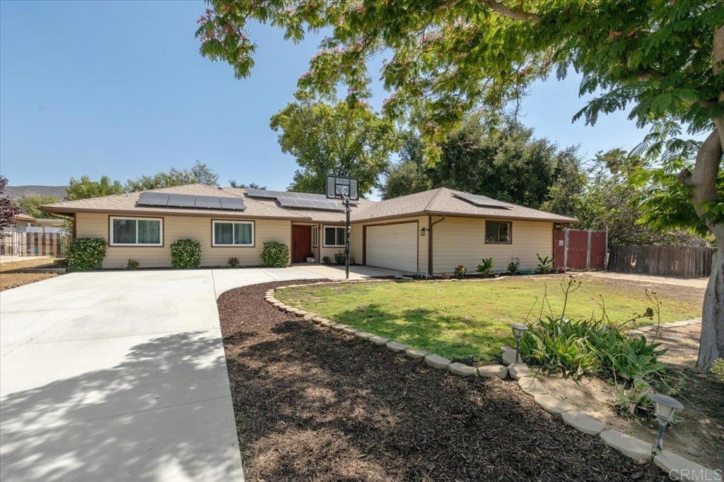 Welcome to this fantastic home - tucked away on a peaceful cul-de-sac street in the heart of the San Diego Country Estates. This home just feels good the moment you walk in. The layout flows effortlessly combining comfort and function and offering plenty of space to spread out or come together. Out back, you’ve got your own perfect little slice of country life complete with horse facilities that include a two stall barn, corrals, and hay and tack shed. The landscaping keeps things simple and low-maintenance so you can spend more time enjoying the outdoors. And don’t miss the adorable cottage-style shed—it’s full of charm and perfect for whatever you dream up: art studio, playhouse, or extra storage. Inside, the home has been nicely refreshed with thoughtful updates and a clean, inviting vibe. One of the standout spaces is the large California room—it’s a showstopper with high beamed ceilings, skylights, and tons of natural light. Whether you're hosting a weekend brunch or just sipping coffee while the kids (or dogs) play outside, it's a space you’ll fall in love with. A brand-new driveway welcomes you home, and the whole place has that freshened-up feel without losing its cozy character. And let’s talk about the community—SDCE is packed with amenities. There are pools for hot summer days, equestrian centers and trails for the horse lovers, a golf course if that’s your thing, and miles of scenic trails to explore on foot or horseback. It’s the kind of neighborhood where you really live—not just reside.