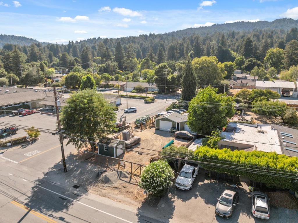 Nestled in the heart of Felton, this versatile C-4 zoned commercial corner property offers an exceptional opportunity with valuable infrastructure already in place. Once the site of a residence that has since been removed, the land now provides an opportunity for future plans while benefiting from existing utilities and improvements. The property features an existing septic system from the prior residence, PG&E power service is available as is Xfinity high speed internet and existing water service. A supplemental solar system exists to meet current needs. The land is fully fenced for privacy and security and includes several storage sheds for practical use. A porta-potty is also on-site. In short, this is a fantastic opportunity for a buyer looking to develop or invest in a flexible commercial space with infrastructure already in place.