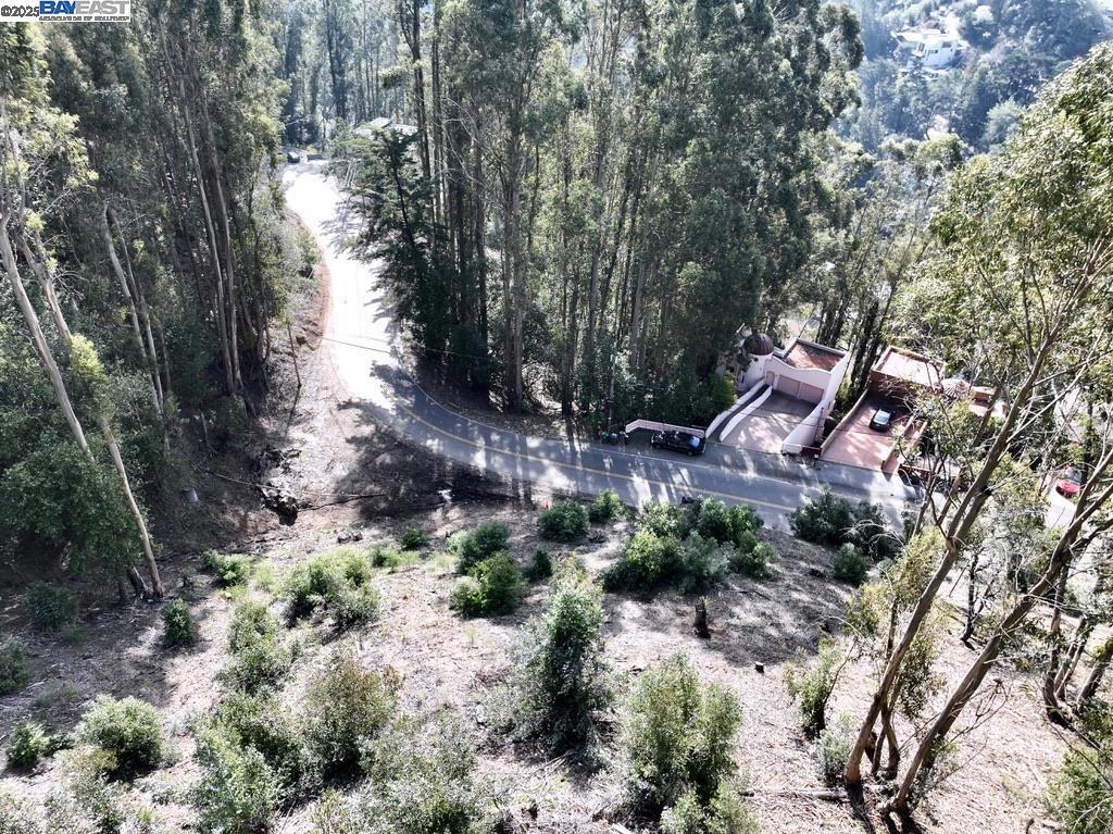 Premium Skyline Blvd Lot Bay Views, Street Access, & Development Potential. Build your vision in the Oakland Hills. This rare Skyline Blvd frontage lot offers views of the San Francisco Bay & paired with the adjoining parcel at 7590 Skyline Blvd, which is potentially landlocked & must be sold together. Together, the two parcels total approx 18,300 sq ft of premium hillside land, offering a unique opportunity for a custom single-family estate, modern luxury retreat, or multi-generational home. Zoned RH-4 (Residential Hillside - 1 unit per 4,000 sq ft), the site is ideally suited for developers, contractors, or homeowners looking to build a dream home with views in one of the East Bay’s most desirable neighborhoods. Public water and sewer are available at the street, and the lots are flanked by city-owned land on both sides, offering added privacy, green buffer zones, and long-term development protection. Minutes from Montclair Village shops and cafes, Rockridge BART, Chabot Space Center, regional parks, and highway access to Berkeley, Oakland, and San Francisco. No soils, survey, or reports are currently available. Buyer to verify buildability and utility connections with the City of Oakland. This is a rare opportunity to design and build in the Oakland Hills, don’t miss it.