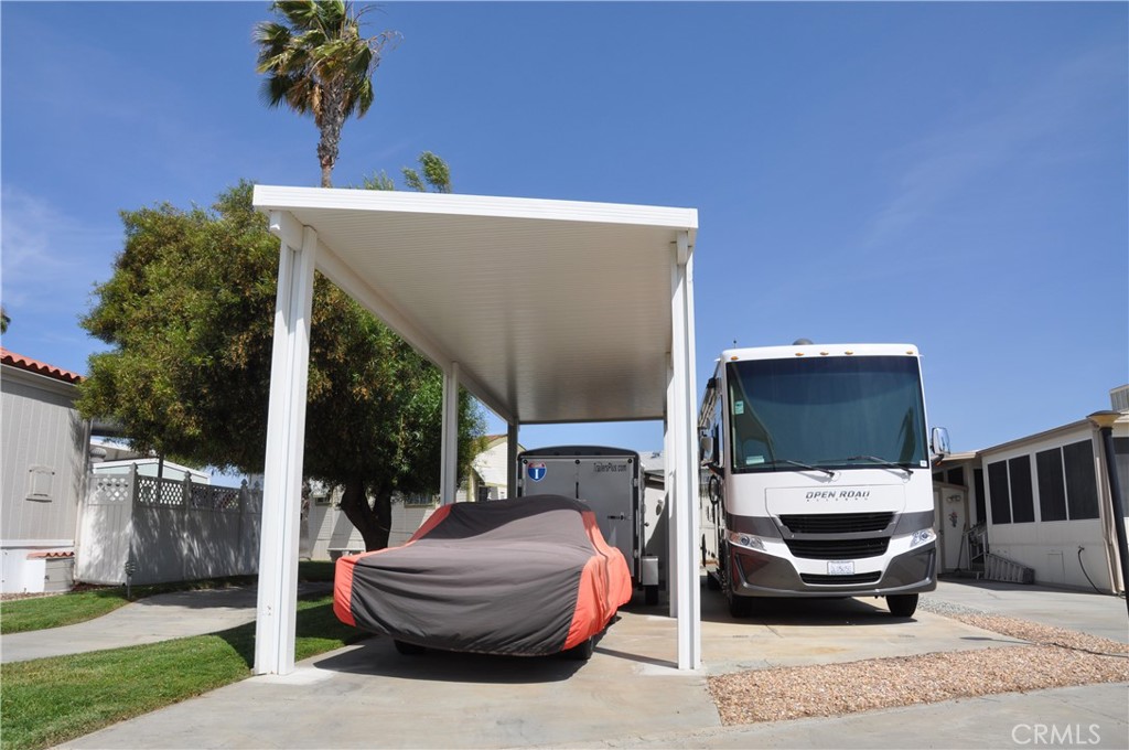 Wonderful opportunity to own a “B” lot in the gated 55+ Mountain Shadows RV Resort! Perfectly situated between both community clubhouses, this lot offers easy access to all the fun and functional amenities—including shuffleboard, pool tables, a fitness center, laundry facilities, indoor and outdoor spas, showers, and more.
This lot is adjacent to a greenbelt and the walkway leading to the main clubhouse. A spacious shed with electricity and lighting is included, along with a brand-new extra-tall carport—ideal for parking your RV, trailer, or installing a new park model.
Whether you're a seasonal resident or looking for a full-time low-maintenance lifestyle, this vibrant community has it all: planned events, social gatherings, indoor and outdoor kitchens, a saltwater pool, library, and friendly neighbors.
Enjoy low taxes and an affordable HOA fee of $243.65/month, which covers water, sewer, trash, basic cable, and internet. Conveniently located near shopping, Diamond Valley Lake, Temecula Wine Country, and more. Don’t miss your chance to invest in resort-style living!
