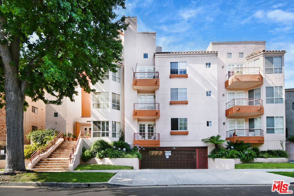 Located in a quiet, South-of-the-Boulevard enclave of Sherman Oaks, this spacious single-level condominium offers 1,960 square feet of refined living in a well-maintained nine-unit building. Set at the rear of the property with peaceful tree-lined views, this end-unit feels more like a private home. The layout features generously sized rooms and hardwood floors throughout the main living areas. The living room includes a fireplace and opens to a private lanai. The elegant formal dining room is enhanced by a built-in buffet and glass-front cabinetry, ideal for entertaining. A chef's center island kitchen is equipped with built-in top of the line Bosch appliances, a breakfast area and French doors that open to a patio. The primary suite includes a fireplace, huge walk-in closet, and a spacious bath with dual vanities and a soaking tub. The second bedroom suite features its own bath, walk-in closet, and custom built-in bookcases. Additional highlights include in-unit laundry, a community pool, gym, and sauna. There are also 2 separate parking spaces and a large private storage room dedicated to the unit. A rare opportunity to enjoy quiet, comfortable living in one of Sherman Oaks' most desirable neighborhoods.
