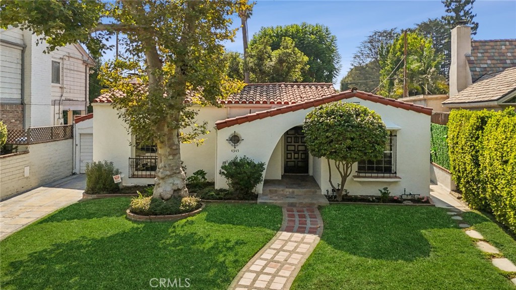 Welcome to a Timeless Spanish Gem in the Heart of Prestigious Toluca Lake
Nestled in the highly sought-after and historically rich community of Toluca Lake, this charming 3-bedroom, 2-bath Spanish-style residence offers the perfect blend of classic character and warm sophistication. Once home to notable celebrities, this property exudes a unique allure and enduring elegance that is rarely found today.
From the moment you arrive, you are greeted by a beautifully landscaped front yard, accented with mature trees and a graceful curved walkway leading to the arched front entry. Inside, the light-filled living room features dramatic open-beam ceilings, a cozy 2 fireplaces and stunning artisan hand scraped collection hardwood floors, creating an inviting space for both intimate gatherings and grand entertaining.
The kitchen and dining areas flow seamlessly to the home’s private, enchanting courtyard — a true centerpiece of this property. Framed by lush greenery and accented with brick and tile details, this outdoor haven is perfect for alfresco dining, morning coffee, or evening relaxation under the California sky.
The home’s 3 spacious bedrooms offer comfort and charm, while the 2 bathrooms showcase exquisite vintage tile work that pays homage to the home’s Spanish heritage. Additional highlights include abundant natural light, unique architectural details, and a prime location just moments from boutique shops, fine dining, and the vibrant Toluca Lake lifestyle.
This is more than a home — it’s a piece of Los Angeles history, offering elegance, warmth, and an unmatched sense of place.