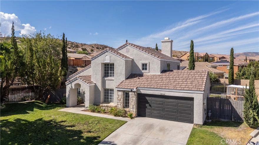 This beautiful home is nestled at the end of a quiet cul-de-sac in one of West

Palmdale’s most sought-after neighborhoods, and as soon as you lay your eyes on it

you’ll immediately recognize he owner’s true “Pride-Of-Ownership.” Here are just a

few of its many other fine features: Lush landscaping, colorful planters, and stone

façade enhance its eye-catching curb appeal . You’ll step into a sunlit 1,924 square

foot open concept floor plan that is in “Move-In-Condition” with soaring vaulted

ceilings, striking architectural accents, new light fixtures, and a complementary blend of

new vinyl and plush carpet flooring with new baseboards. Spacious living room

accented by the staircase with custom railing. The family’s cook is going to truly

appreciate the recently updated kitchen’s recessed lighting, large garden window,

abundant cabinets, pantry, new quartz counters, new built-in stainless steel

appliances, durable dual basin stainless steel sink, breakfast bar, sit down breakfast

alcove with direct patio access, and the convenience of the adjoining formal dining room.

Since the family room with its gas-burning fireplace flows seamlessly with the kitchen

you’ll find it easy to serve and entertain your guests simultaneously.  All 4 bedrooms

have new ceiling fans; The downstairs bedroom has its own full bathroom making it

perfect for guests. The grand suite has a large walk-in closet with built-in organizers,

and a sumptuously appointed bathroom with large dual sink mirrored vanity with new

fixtures, soaking tub, custom tiled glass enclosed shower with new door, and private

commode. All 3 bathrooms have new custom tile flooring. Functionally located

laundry room. Energy efficient dual pane windows and large solar panel array will

help keep your utility bills low. Central air &amp; heat. You’re going to enjoy the large

backyard with its huge entertainer’s patio. 2 car direct access garage. All of this sits

on a huge 11,252 square foot lot that is close to schools, parks, grocery stores,

restaurants, the Palmdale Marketplace Mall, and the 14 freeway. Call now for all the

details and I’ll gladly arrange your private tour. Solar panels paid off.
