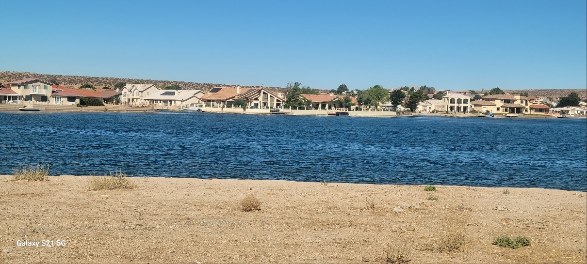 Lakefront Vacant Lot on South Lake in Silver Lakes in Helendale, CA. Breathtaking view lot. Drive by and take a look. Ready to build your dream home in Silver lake community. HOA Dues include use of all of amennities including 27 hole Golf Course, Tennis courts, Bocce Ball courts,Pickle Ball courts, Clubhouse, Library, swimming pool, Gym, RV Park and storage, Equestrian facilities, Beach and Boat Launch, and more.