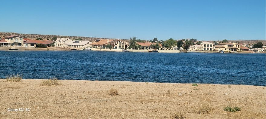Lakefront Vacant Lot on South Lake in Silver Lakes in Helendale, CA. Breathtaking view lot. Drive by and take a look. Ready to build your dream home in Silver lake community. HOA Dues include use of all of amennities including 27 hole Golf Course, Tennis courts, Bocce Ball courts,Pickle Ball courts, Clubhouse, Library, swimming pool, Gym, RV Park and storage, Equestrian facilities, Beach and Boat Launch, and more.
