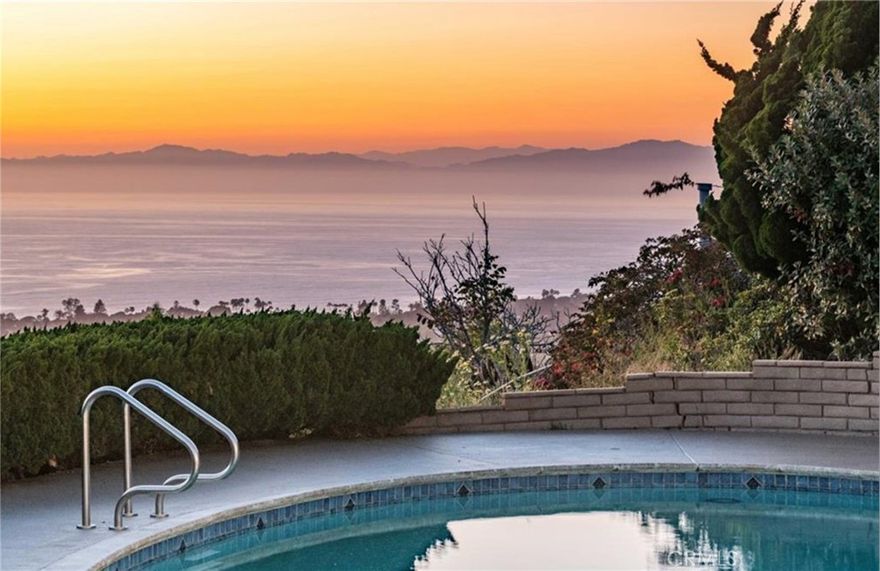 Ocean View! Beautifully upgraded, ocean view home with excellent open layout perched on sunny hillside lot on private cul de sac street. Enter the light filled home to see idyllic ocean and PV cliff views that are the backdrop to nearly every space. Step down into living room with wall to wall doors that frame jaw dropping views. Relax in there next to the fireplace or step outside to picturesque outdoor living space with east to west views of Pacific ocean, striking PV cliffs, pool, manicured lawn for lounging and play, and patio/ BBQ/ dining area. Views are enjoyed from every angle in the chic, light filled kitchen that enjoys a breakfast nook as well as roomy, separate dining area with views and cozy fireplace. Spacious master suite features wall to wall views, walk-in closet, and lovely bathroom with walkout to backyard through private entry. Home features private hallway that opens to 2 large bedrooms and flawless bathroom with jacuzzi tub and separate shower. Library/ office/ den and additional bedroom enjoy large deck perfect for enjoying PV days/ nights. Generous downstairs family room is captivating with soft sunlight reflecting off ocean into the space. The impressive entertainment space offers fireplace, wet bar, and doors leading outside for easy indoor outdoor living.Located within an award-winning school district, this home offers the perfect blend of comfort, style, and coastal living.