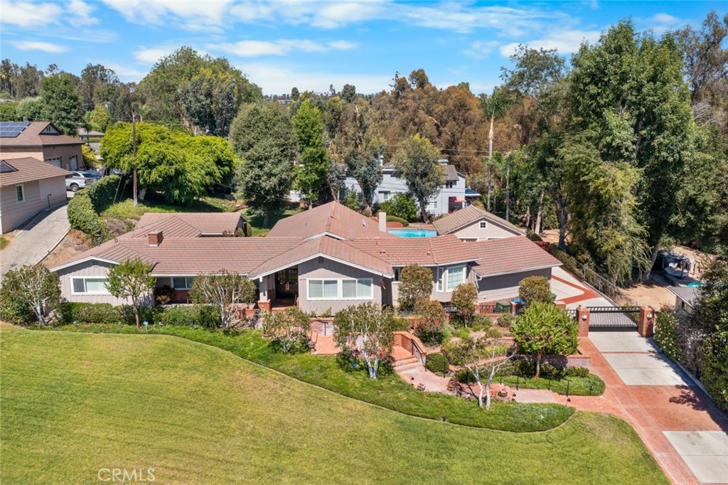 Welcome to this beautifully maintained 4-bedroom, 3-bathroom home nestled in the prestigious Old Friendly Hills neighborhood of Whittier. Situated on a generously sized lot with impeccable landscaping, this home is perfect for entertaining and enjoying the Southern California lifestyle.From the moment you arrive, you'll be impressed by the curb appeal and the care poured into the grounds. Step inside to find spacious living areas, two cozy fireplaces, and dual-pane windows that let in an abundance of natural light while keeping energy efficiency top of mind. The home features two newer HVAC units, a soft water system, and upgraded copper plumbing throughout for peace of mind.Love cars or need extra storage? The oversized 4-car garage is a dream for car enthusiasts or hobbyists. Outside, the backyard is your private oasis—complete with a newly replastered and tiled pool, ideal for weekend lounging or summer parties.This is more than just a home—it's a lifestyle opportunity in one of Whittier’s most desirable neighborhoods. Don’t miss your chance to own a rare gem in Old Friendly Hills.
