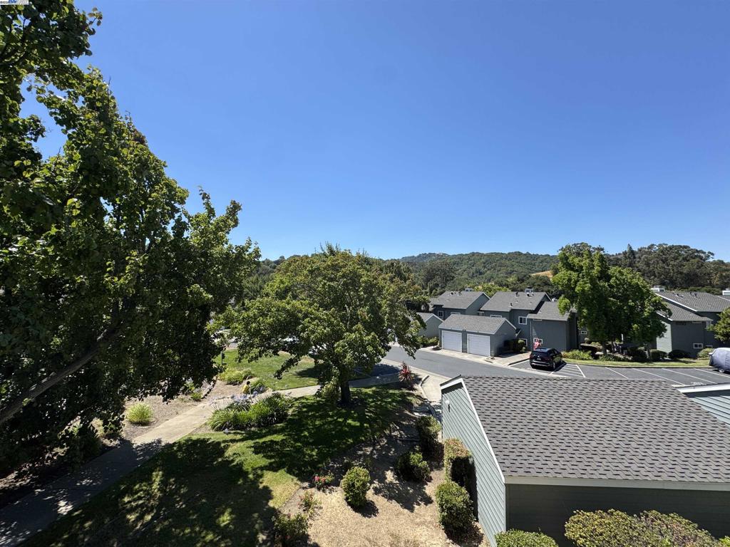Discover the comfort of this move-in ready and sparkling clean condo in the highly sought-after Canyon Meadows community of Pleasanton! This stunning 3-bedroom, 2-bathroom rental unit is ideally situated near the community pool and features a 1-car garage with a rare extra-long driveway for additional parking convenience. Inside, you'll find a welcoming interior with freshly painted walls and cabinets, an inviting fireplace, and a beautifully updated kitchen featuring brand-new countertops. Both bathrooms have been recently upgraded with stylish new tile flooring and completely renovated shower stalls with modern tile work throughout. The condo includes a washer and dryer for your convenience and offers two private balconies with serene views of the nearby hills—perfect for morning coffee or evening relaxation. Located just minutes from Stoneridge Mall, parks, restaurants, and excellent commuter routes, this rental combines modern updates with practicality in one of Pleasanton's most desirable neighborhoods. This exceptional rental opportunity won't last long in today's competitive market!
