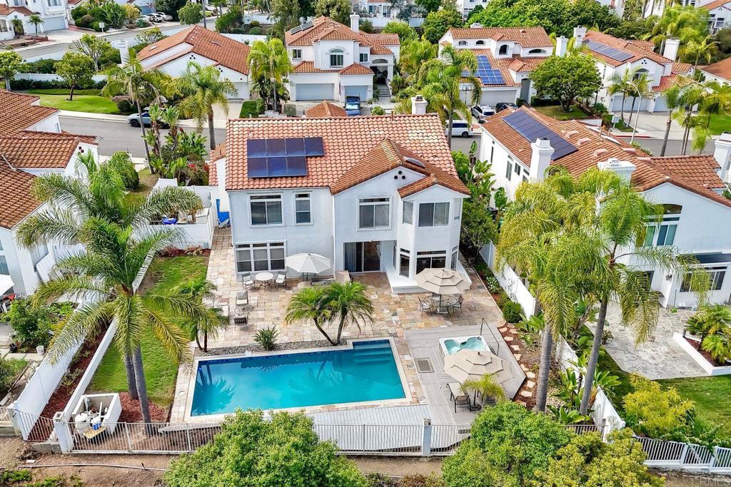 Welcome to South Ridge Estates in Ocean Hills. This stunning property features 3,046 square feet of inviting living space, offering 4 bedrooms, 3 bathrooms, and a loft that can serve as an optional 5th bedroom. Sitting on an expansive 0.21-acre lot with a resort-style backyard. You'll find a sparkling newly refinished pool, a relaxing spa, a large outdoor BBQ area, upgraded new vinyl fencing, leased solar, and hillside views with breathtaking sunsets. As you step inside, you'll be welcomed by soaring vaulted ceilings and an abundance of natural light. The formal living room exudes coziness and charm, featuring a beautiful fireplace. The dining room is both grand and inviting, complete with French doors. The elegantly updated kitchen showcases new stainless steel appliances, including a double oven, granite countertops, and a spacious eat-in nook that overlooks the stunning yard. On the main level, you will also find a generous private bedroom that could be ideal as an in-law suite, and a remodeled full bathroom with direct access to the outside, making pool visits easy. The primary bedroom is a sanctuary, offering a cozy seating area, amazing views, and a beautifully remodeled bathroom with an oversized soaking tub, a separate shower, and a spacious walk-in closet. Additional features include fresh interior and exterior paint, new plush carpeting, tile flooring, modern lighting, an updated laundry room, an oversized three-car garage with the 3rd bay enclosed and insulated, and a newer roof. Conveniently located within walking distance to award-winning Vista schools, shopping centers, entertainment, dining, gyms, and just 7 miles to the beach. This home is move-in ready, providing luxurious living and peace of mind for years to come. Don’t miss this rare opportunity to own a meticulously maintained property in a fabulous neighborhood!