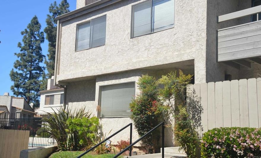 Spacious and clean - large 3 bedroom and 2.5 baths - half bath downstairs, laundry closet downstairs, laminate flooring, fresh paint, and has been a very good rental for several years - master bedroom balcony overlooks the community pool - right off the 805 freeway and Main Street. makes this conveniently located.  Call Co-listing agent for showing appointment. Tenant under lease until March 31st but we can negotiate a move out if needed.