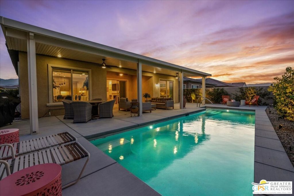 Highly upgraded and amazing Panoramic Mountain views (Must see in person!). Upgraded porcelain tile, ceiling fans, and custom window treatments throughout. This Phase 6, PLAN 7, REFUGE, with Tuscan facade has three bedrooms and two and a half baths. Kitchen features upgraded 42-in upper cabinets with Jewel cabinets and crown molding in a gray finish with upgraded matte gold hardware, kitchen features upgraded quartz countertops with full backsplash to ceiling, upgraded KitchenAid professional series appliances with Bluestar refrigerator, and large island with ample space for seating. The kitchen overlooks the great room featuring upgraded center glass sliding doors, a fireplace and built-in display niches with LED lighting as well as a built-in wet bar with ample cabinetry and beverage refrigerator. The primary bedroom offers breathtaking panoramic Mountain views and an upgraded glass sliding door offering access to your private pool. The ensuite bathroom features an upgraded no threshold glass enslosed rain shower with bench, upgraded gray cabinetry with dual sinks and a large walk-in closet. The guest wing is located on the opposite end of the home and offers access to the two additional bedrooms and a full bath. This home also features a versatile flex space that can be used as a den, media room, yoga space or more. This home also features an upgraded laundry room with additional cabinet storage and utility sink and leased SOLAR (($157.95 mo)! Step outside into the backyard until your covered patio space and take in the magnificent Mountain views from your extended covered patio. Complete with LED lighting and ceiling fans as well as a custom angular modern pool. This home is an entertainer's delight with ample yard and extended covered patio spaces as well as mingling areas and ample space for guests. This property is a must-see. Add this to your list, you won't be disappointed. Come see all that this 55+ community of Del Webb has to offer in prestigious Rancho Mirage with access to a state-of-the-art clubhouse featuring a bar, billiards table, pool and Spa, fitness center, and so much more.