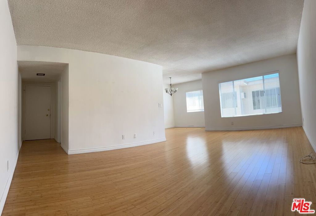 Large bright upper unit in Prime Santa Monica Location. Hardwood floors in the living room and dining area updated kitchen with White Quartz Counters and all built-ins, Primary bedroom with walk-in closet and own remodeled bath.