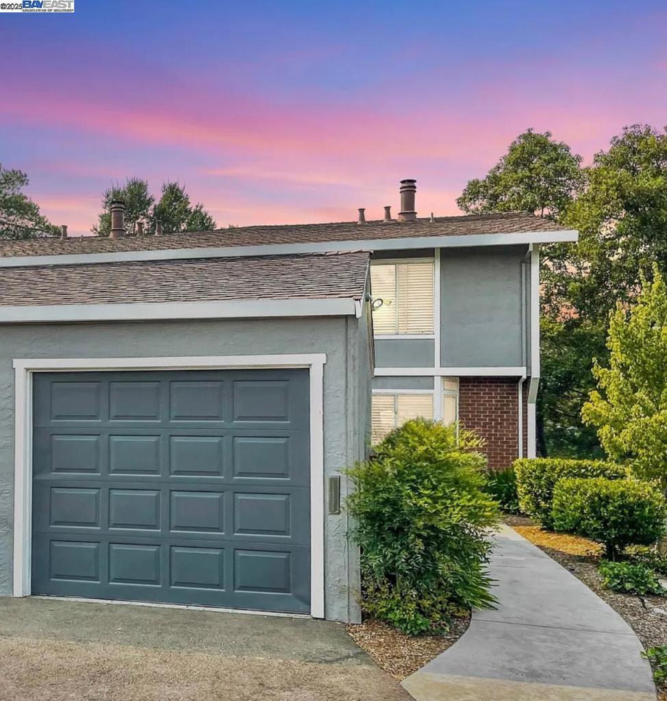 Welcome to 824 Royal Ann Lane, ideally located right on the Walnut Creek border, offering the best of both worlds—peaceful residential living with quick access to Walnut Creek’s vibrant downtown, top-rated schools, scenic parks, and BART for an easy commute. This beautifully renovated multi-level home in the desirable Cherrywood Community has been transformed inside and out. Step into the light-filled living room, where vaulted ceilings and a cozy gas fireplace set a warm, inviting tone. The brand-new kitchen shines with modern cabinetry, sleek countertops, and stainless steel appliances, while the updated bathrooms and new flooring throughout give the home a fresh, move-in-ready feel. The smart layout features a dedicated dining area, three well-appointed bedrooms—including a serene primary suite with generous mirrored closet space—and in-unit laundry for everyday convenience. Outside, a tranquil private patio and a low-maintenance backyard with artificial grass, offering year-round beauty without the upkeep. Additional highlights include a one-car garage, access to community amenities such as a sparkling pool, tennis courts, and greenbelt, plus a prime location near shopping, dining, and walking trails. This is where amazing value, comfort, and location come together.