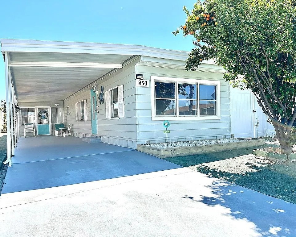 EXCEPTIONAL VALUE. REDUCED TO SELL TO A LUCKY BUYER. MOTIVATED SELLER. "OWN YOUR LAND". ATTENTION TO ALL INVESTORS/HOMEBUYERS. NEW PRICE: $120K. REMODELED MOVE-IN READY". Welcome to Sierra Dawn Estates 55+ Community. NO AGE LIMITATION TO BUY. This charming and spacious 2 bedrooms 1 Bath bungalow style remodeled home. This home features an Open Concept Layout Kitchen it's Open to the Living Room with Abundant Natural Light through the Skylight and Large Windows. As you enter your home you will have a Remodeled Kitchen, NEW Stainless-Steel Refrigerator, New Kitchen Vent Hood. Home has a Central HVAC System Furnace and Water Heater. Roof and Skylight has been updated in the last few years. As you walk to the hall are 2 bedrooms with an updated guest bathroom. At the end of the hall is the large primary bedroom with ample of closet storage. Second bedroom is cozy with a good size closet, ready for your guests or family. The spacious bonus room/enclosed patio is perfect for relaxing. office, den or entertaining guest. Low maintenance landscaping and good size for entertaining family/friends or just relaxing. Several Fruit Trees including Pomegranate, Peach, Lemon, Mandarin and Oranges. Also, 2 Covered Parking. Sierra Dawn Estates provides beautiful amenities including 5 pools, 4 spas, 4 clubhouses, laundry facility, gym, gated dog park, pickleball/paddle tennis court, HOA is $168/month. Brand new in-house hot and cold Washer and Gas Dryer. Don't miss this opportunity to own this beautiful home!!!