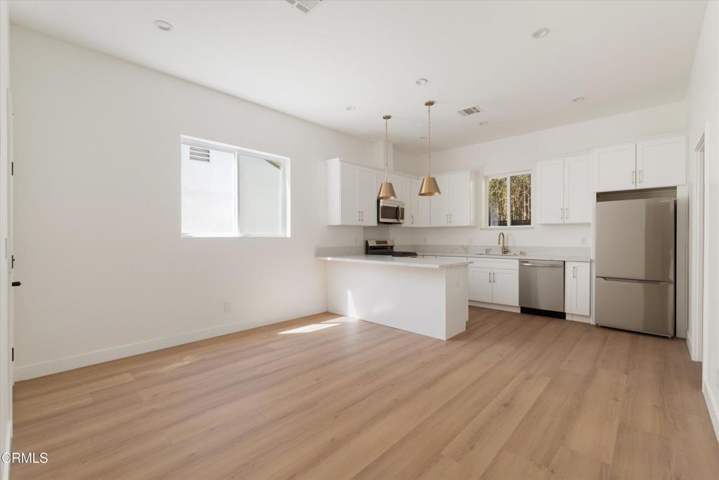Be the first to live in this beautifully constructed 2-bedroom, 2-bathroom ADU located in Granada Hills. This brand-new unit features high ceilings, quality finishes and laminate wood flooring throughout. The kitchen is fully equipped with a suite of Samsung stainless steel appliances, quartz counters, abundant cabinet space and a peninsula with bar seating. Both bedrooms provide generous closet space, while the primary suite includes a private ensuite bath with a spacious walk-in shower. Additional highlights include in-unit laundry, central AC, ample street parking and a quiet, residential setting that offers both privacy and convenience. Don't miss the opportunity to enjoy a newly built home with all the modern amenities!
