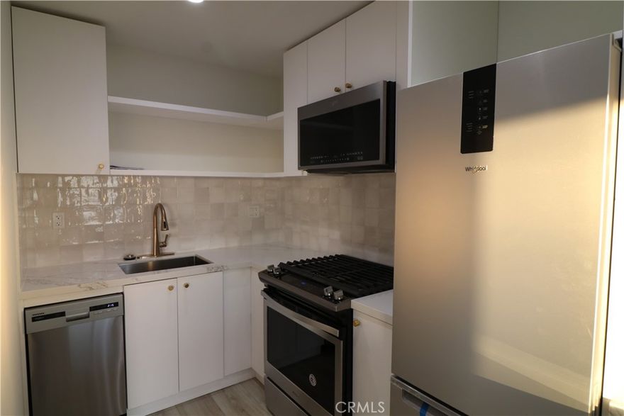 Welcome to a stunning coastal property that boasts ocean views, luxury amenities, and a prime location in the heart of North Laguna Beach next to Shaw's Cove. Enjoy full panoramic ocean view sunsets from the balcony of this top level unit. As you enter the property, you'll be immediately greeted by a bright and airy living space, complete with large windows that showcase the breathtaking views of the Pacific Ocean. The open floor plan seamlessly blends the living room and kitchen, creating an ideal space for entertaining guests or simply relaxing at home. The recent remodel includes elegant stone, tile and hardware finishes, new hard floors. The kitchen features new stainless steel appliances, granite countertops, and new cabinetry, making it the perfect place to prepare gourmet meals. In addition AC has been added to the property. A shared laundry room is provided and one dedicated parking spot is included. This is an ideal location to enjoy all the perks Laguna Beach has to offer!
