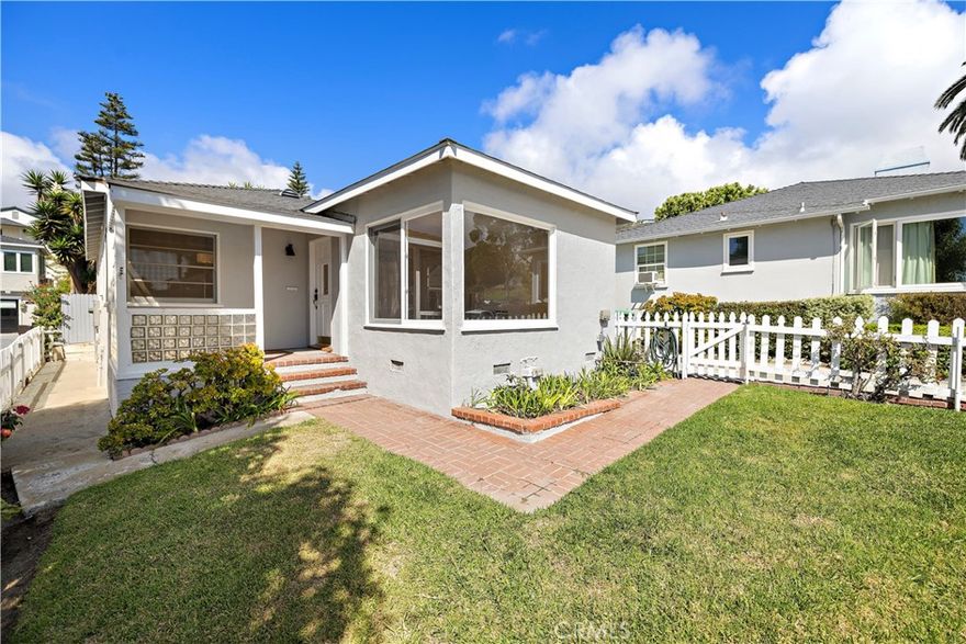 Charming Laguna Beach Village Cottage 



Location, location! Just steps from the beach and the heart of downtown Laguna Beach, this beautifully restored coastal cottage blends charm, comfort, and convenience. The spacious living room features large picture windows with ocean views and abundant natural light. The fireplace serves as a charming decorative centerpiece, enhancing the home’s cozy coastal character, though it is not operable.

The bright and inviting updated kitchen offers quartz countertops, a pantry, and in-kitchen laundry with new appliances, including a washer and dryer. A separate dining area with an ocean view provides the perfect setting for intimate dinners or casual gatherings.

The fully renovated bathroom features a walk-in shower, ample storage, and a modern vanity with a quartz countertop.

Both bedrooms feature ceiling fans, ample closet space, and the main suite opens through French doors to a serene, shaded patio—ideal for relaxing outdoors. The home showcases stylish hardwood floors throughout, Marmoleum flooring in the kitchen and bath, and Hunter Douglas window coverings. 



Enjoy a fenced front yard with landscaping service included and private rear patio. A covered, gated carport accommodates a small-to-midsize vehicle or golf cart, and includes EV rapid charging as well as bicycle storage, plus an additional driveway parking space.

This prime Village location offers easy walking access to the beach, shops, restaurants, and galleries.

Experience the best of Laguna Beach coastal living in this storybook cottage by the sea.