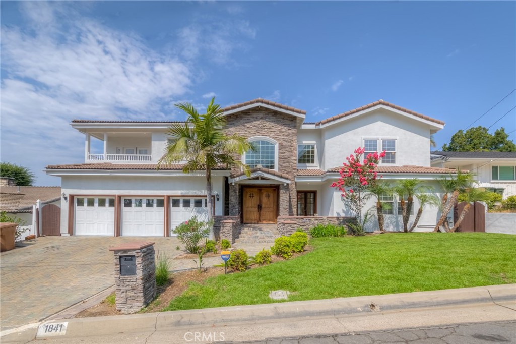 Stunning Custom Estate in Prestigious Raymond Hills – Fully Remodeled with City Lights & Canyon Views! Welcome to this beautifully built and fully upgraded custom estate. Nestled at the end of a quiet cul-de-sac, this exceptional home offers an expansive and versatile layout featuring 6 spacious bedrooms, all with en suite bathrooms, including three located on the main level, ideal for multigenerational living or extended families. Located within the award-winning schools near by, this home effortlessly combines luxury, comfort, and top-tier education access. Step through grand double doors into an elegant foyer with soaring ceilings, a sweeping staircase, and a welcoming sitting area framed by French doors. The heart of the home — the fully remodeled kitchen — boasts quartz countertops, a stylish tiled backsplash, two sinks, breakfast bar, a sunny breakfast nook, and brand-new high-end Viking appliances, including a Viking 8-burner range and Viking dishwasher. Adjacent to the kitchen is an expansive great room featuring a dramatic two-story ceiling, fireplace, an abundance of windows, and French doors that lead to the private backyard, the perfect space for indoor-outdoor living and entertaining. A formal dining room with its own French doors completes the elegant entertaining space. Upstairs, a spacious secondary living area offers access to a balcony, ideal for a game room, library, or lounge. The primary suite is a luxurious retreat featuring its own fireplace, private sitting area, balcony access, and a custom walk-in closet with built-ins. The attached private office includes a Juliet balcony overlooking the great room and additional balcony access.The completely remodeled primary bathroom exudes spa-like elegance with a brand-new freestanding soaking tub, an oversized walk-in shower, and luxury tile finishes throughout. Additional upgrades and highlights include: All bathrooms fully remodeled with designer finishes, New engineered hardwood floors throughout, Fresh interior and exterior paint, Paved brick driveway for enhanced curb appeal,3-car direct access garage. Close proximity to hiking trails, equestrian paths, shopping, dining, and more. This one-of-a-kind custom home is a rare find, offering modern elegance, flexible living spaces, and breathtaking views, truly move-in ready and ideal for a multi-generational or extended family lifestyle.