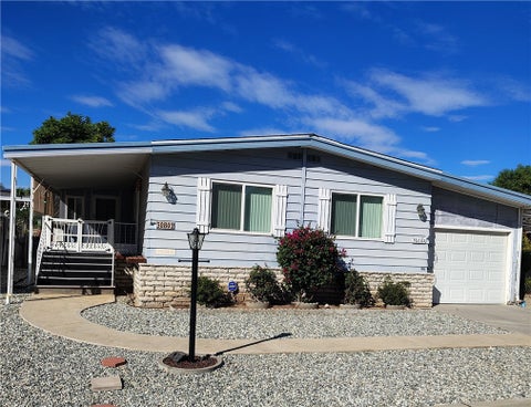 Photo of 30802 Cocos Palm Avenue, Homeland, CA 92548 (MLS # SW26223981)