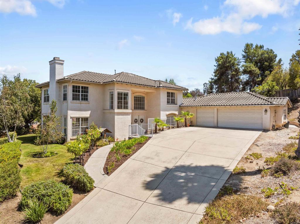 Welcome to your GORGEOUS new home! Situated on an elevated half acre VIEW lot in a quiet cul-de-sac, offering both privacy and stunning vistas. Located in a highly desirable neighborhood with NO HOA, just 20 minutes from Oceanside/Carlsbad Village and the Pacific Ocean. Perhaps the best weather in the US! This 4 Bedroom PLUS OFFICE, 3 Bath Home has everything you want!! The sellers have just completed the addition of a wonderful office space with french door to side patio, new interior paint, beautiful patterned carpet and 2025 bathroom remodels! This home has been meticulously cared for! Other outstanding features are the OWNED SOLAR system along with waterproofing underlayment of the tile roof, both installed in 2022. Some of the interior features include Quartz and Granite Countertops, wood look Tile floors, Double Entry Doors, Custom window coverings, Fireplace in the Living and Family Rooms, Ceiling Fans, modern light fixtures, built in Appliances, walk in Master Closet with organizers, and a large indoor Laundry Room with brand NEW washer and dryer set (Aug 2025). Home is also plumbed for central vacuum (no unit). Attached garage has electric charging ports for 2 EVs. Outdoors the home has a deep, long Driveway with plenty of room for an RV or other toys and ample room in the yard for a pool and even a basket ball area. Beautifully landscaped yards to enjoy the beautiful So Cal outdoors! Located near Guajome Park and the GP Academy Charter School, K-12.