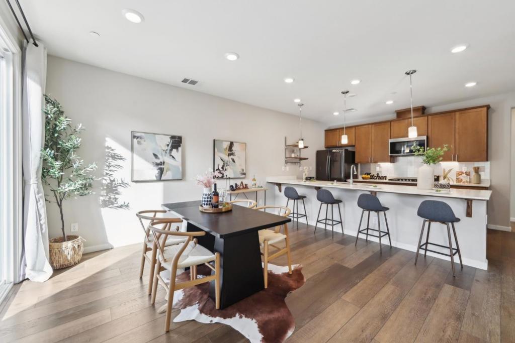 This modern home is ideally located in the heart of Milpitas, combining convenience and lifestyle. Nestled in a highly desirable community, it is just minutes from leading tech companies, making commuting effortless. With close access to the Milpitas BART station and major highways, traveling across the Bay Area is quick and efficient. The neighborhood offers abundant recreation with parks, walking trails, and open green spaces nearby, creating a peaceful retreat after a busy day. Shopping and dining are right around the corner at the Great Mall and other local favorites, making every weekend enjoyable. HOA covers master insurance, adding value and security for homeowners. Inside, the home features cutting-edge smart technology, including a smart thermostat, washer and dryer, and a smart doorbell, enhancing comfort, energy efficiency, and peace of mind. Bright, open living spaces are complemented by modern finishes and a thoughtfully designed floor plan, perfect for todays lifestyle. Whether entertaining friends or enjoying quiet evenings at home, this property delivers both style and function. More than just a residence, it is a gateway to an elevated lifestyle in one of Milpitas most sought-after areas. Dont miss the chance to make it yours!