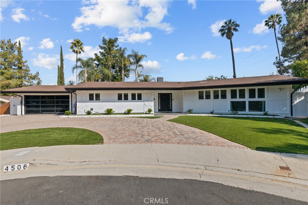 Modern luxury and masterful design are uniquely embodied in this luxurious Tarzana property at
the end of a large cul-de-sac. The attention to detail is evident throughout this home with premium
finishes including new HVAC and attic insulation. Also including skylight and double glazed
windows. Immediately you are captivated by the serene ambiance. The lovely floor plan encompasses
4 bedrooms and 2 bathrooms with all new solid doors, plus a bonus powder room. Ideal for entertaining
or simply relaxing, the upscale living room with modern glass rock fireplace opens to an oversized backyard
with new white vinyl fencing with two gates, manicured backyard with artificial turf and pavers. A huge oversized
pool with two new LED lights and recently upgraded new heater, gas line, pool motor and electrical panel.
The home's sleek gourmet kitchen balances style with functionalism. It will inspire your inner chef with
its modern design and high-end amenities such as stainless-steel appliances, quartz counters and a
farmhouse style sink. Retreat for the evening to the extensive master suite complimented by recessed
lighting and a view of the backyard oasis from the French doors. The exquisite finishes in the en-suite
bathroom include a double vanity and a soaking tub complimented by a chandelier. The picturesque
backyard oasis is an entertainer's dream! Also, backyard has room for additional income by building
a 1200 square foot ADU with separate entrance. The front yard had been recently upgraded with artificial turf and new glass garage door with epoxy flooring. This impeccable home offers a resort
like setting, yet its prime Tarzana location is central to LA's most desirable attractions including Braemar
Country Club and Golf Course and mountains to hike! Do not miss!