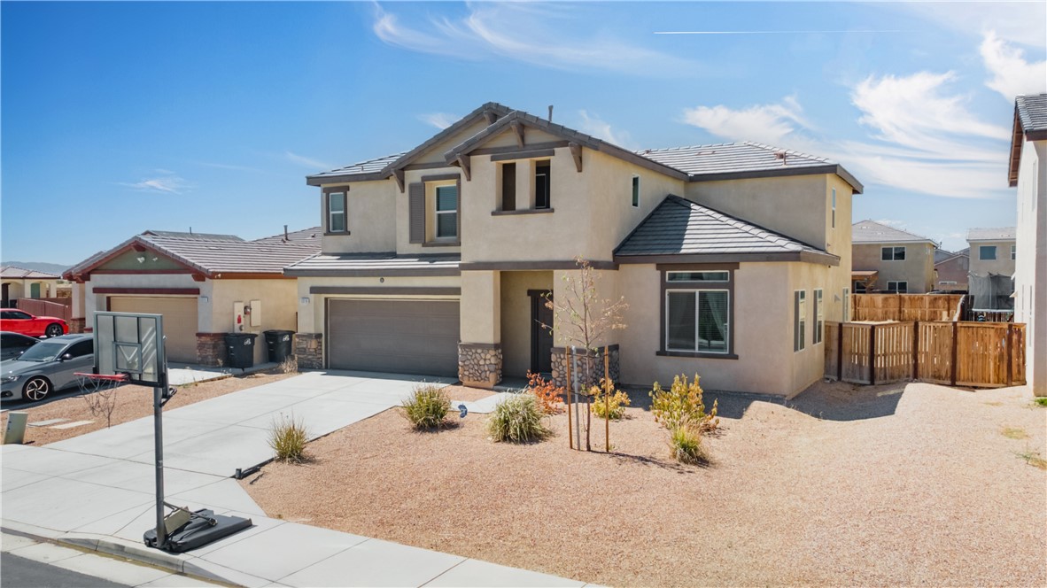 Welcome Home!!! Why pay more when you can have space, comfort, and style for a fraction of the price? This newer-built home was designed with family living in mind. From the moment you step in, the soaring vaulted ceilings create an airy, open feel. Gather in the formal living and dining rooms for the Holidays or enjoy casual evenings in the oversized family room that flows right into the kitchen-the heart of the home and the perfect spot for entertaining. Hosting out of town guests? The first-floor bedroom and full bath give them privacy and convenience. Upstairs, the loft offers flexibility-movie nights, a playroom, or even a fifth bedroom if you need it. The primary suite is a true retreat with two walk-in-closets and plenty of space to unwind. Step outside to your massive backyard-a blank canvas ready for your dream outdoor living space. Imagine barbeques, play areas, gardens or even a pool. All this, to include solar savings and only 15-20 minutes from West gate at Edwards AFB.