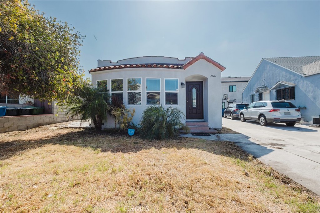Completely renovated after a fire in 2021, this Mid-City gem seamlessly blends modern comfort with classic character. Step inside to a sun-splashed living room framed by a distinctive white fireplace and a curved wall of windows, with rich laminate wood-style floors flowing into the open dining and kitchen areas. The kitchen features custom wood cabinetry, granite counters and glass-front uppers, plus a deep sink and gas range – perfect for home chefs and entertaining. Updated baths showcase contemporary vanities, sleek fixtures and a combination tub/shower and separate walk-in shower. Each of the three bedrooms offers generous natural light, ceiling fans and new windows, while central HVAC, updated electrical systems ensure peace of mind. Outside, the freshly stuccoed exterior and newer roof complement a private backyard with room for gardening or alfresco dining. A long driveway easily accommodates three vehicles, and the detached two-car garage offers space for an additional two vehicles or potential for a workshop, gym, studio or ADU conversion.
The location is a true advantage: Whole Foods is about a mile away, shopping centers are roughly one and half miles away, and the nearby Expo Line station (about a mile) whisks you to Santa?Monica’s beaches or Downtown LA—perfect for beating traffic. You’re also minutes from The Grove, Culver City Arts District, and outdoor escapes like Kenneth Hahn State Recreation Area. A rare opportunity to own a move-in ready home in a central, amenity-rich neighborhood – welcome home!
The property is a PROBATE. Seller has limited authority under the Independent Administration of Estates Act (IAEA); therefore, any sale is subject to court confirmation and overbid procedures. The property is being sold in AS-IS condition.