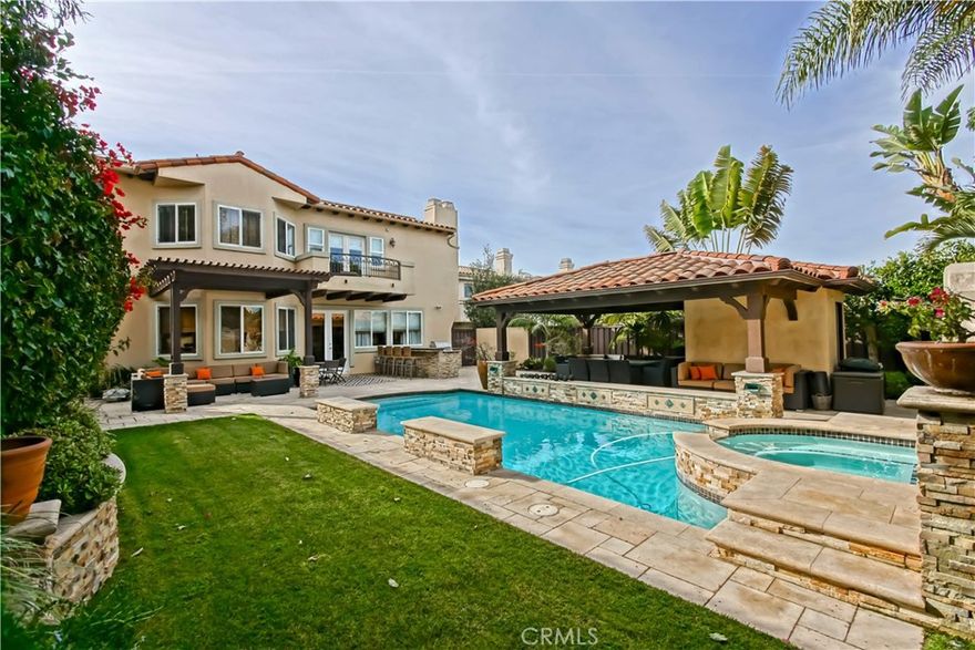 When we say “grand,” we mean grand. This isn’t just a house—it’s a statement. A 5-bed, 5-bath, 4,208 sq. ft. masterpiece of elegance and space (plus a 90 sq. ft. pool bathroom, bringing it to nearly 4,300 sq. ft.), designed for living large and entertaining even larger. From the moment you step inside, towering ceilings, dramatic archways, massive windows, and a show-stopping staircase set the tone—this home isn’t holding back. Let’s talk details. Wood floors? Check. Skylights? Absolutely. A formal living and dining room with a two-way fireplace? You bet. And let’s not forget the Chef's kitchen—large granite island, bar seating, top-of-the-line appliances, pantry, breakfast nook, and seamless flow into the family room with fireplace and backyard. And oh, that backyard… This is where entertaining dreams come to life. A sparkling pool, waterfall jacuzzi, outdoor kitchen with bar seating, TV, gazebo, grassy play area, mini fridge by the BBQ, and a full bathroom create the kind of outdoor setup people talk about long after the party ends. The Primary Suite? Pure luxury. Double-door entry, soaring beamed ceilings, private fireplace, balcony overlooking the backyard, and a HUGE walk-in closet (bring your entire wardrobe). The spa-style bath? Jetted tub, dual vanities, and a glass walk-in shower with dual shower heads. Need space? You got it. The upper-level wraps around four bedrooms, including a Jack-and-Jill setup, an en-suite guest room, and a skylight-lit hallway. Meanwhile, a downstairs bedroom with a full bath and garage access offers the perfect office, gym, or guest space. And now, let’s talk next-level convenience. This home is fully solar-powered, with additional panels being installed to cover 100% of electricity with one EV. Plus, two Tesla batteries ensure extended power during outages. Got an EV? The garage includes an EV charging outlet—just plug in and go. Tech lovers, this one’s for you—Gigabit internet, gigabit ethernet in every room, plus Nest Wifi Pro for seamless coverage inside and out. Smart home automation? Absolutely. Schlage WiFi front door lock (virtual keys included), MyQ internet garage door, Ring doorbell, two indoor Nest cameras, four outdoor Nest cameras with floodlights, and nine Nest smoke/CO2 detectors. Even the side door is electronic, and the Honeywell WiFi thermostat keeps the climate just right. This home goes above and beyond and certainly won't stick around for long.