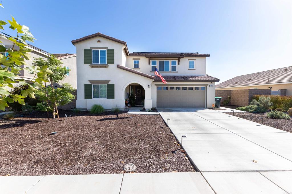 Welcome home to this stylish 2022-built 4-bedroom, 3-bath home offering 2,240 sq ft of modern living in a quiet Hemet neighborhood. The open layout features a bright kitchen with sleek cabinetry, stainless steel appliances, and a large island that flows into a spacious family room—perfect for gatherings or relaxing nights in. The main floor includes a guest bedroom and full bath, while upstairs you'll find a generous primary suite with a walk-in closet, dual-sink vanity, and step-in shower. Energy-efficient solar, smart home features, a whole-home water softener, and central HVAC add comfort and savings. The backyard is ready for entertaining with an extended concrete patio, a covered patio area, and irrigation in place for easy landscaping. Complete with a 2-car attached garage and a 6,098 sq ft lot close to parks, schools, and shopping.