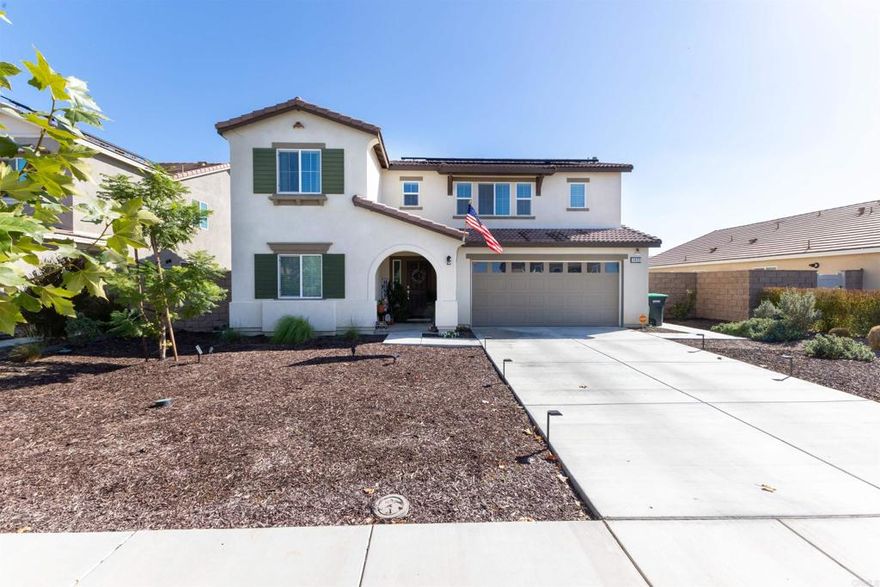 Welcome home to this stylish 2022-built 4-bedroom, 3-bath home offering 2,240 sq ft of modern living in a quiet Hemet neighborhood. The open layout features a bright kitchen with sleek cabinetry, stainless steel appliances, and a large island that flows into a spacious family room—perfect for gatherings or relaxing nights in. The main floor includes a guest bedroom and full bath, while upstairs you'll find a generous primary suite with a walk-in closet, dual-sink vanity, and step-in shower. Energy-efficient solar, smart home features, a whole-home water softener, and central HVAC add comfort and savings. The backyard is ready for entertaining with an extended concrete patio, a covered patio area, and irrigation in place for easy landscaping. Complete with a 2-car attached garage and a 6,098 sq ft lot close to parks, schools, and shopping.