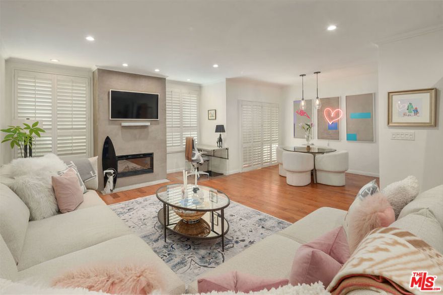 THIS HOME IS NOT YOUR USUAL COOKIE-CUTTER CONDO.  With its warm, inviting interior, formal entry, oversized rooms, arched doorways, custom built-ins and fenced-in private patio, this feels more like a single family home.  The spacious living room with sleek fireplace and recessed lighting flows seamlessly to an oversized dining area perfect for easy entertaining. Sliding glass doors open to the huge, covered patio creating a seamless indoor-outdoor living experience. The well-appointed kitchen has been completely renovated with new stainless-steel appliances, stone counters and generous custom cabinetry. The extra-large primary suite features a beautifully renovated luxury en-suite bathroom and a walk-in closet large enough for a small gathering!   A second renovated bathroom with its spa-like soaking tub offers the ultimate in relaxation.   The generously sized second bedroom has great storage with a full wall of closets.   Additional upgrades and amenities include central HVAC, in-unit laundry, custom sound-proofing and additional storage.  And that patio!  300+ square feet of private space big enough for outdoor entertaining and even creating small gym area.  This home comes with two side x side parking spaces and resort-style amenities, including a brand new sparkling pool, and spa deck. Turnkey, sophisticated and spacious, this home is ready for you to move in and enjoy the best of city living surrounded by the celebrated fine dining, retail and nightlife that West Hollywood is famous for.