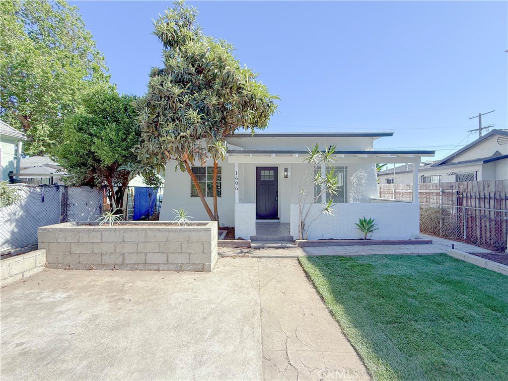 LIVE IN ONE UNIT RENT THE OTHER! Absolutely stunning FULLY REMODELED single family residence right across the street from beautiful Harvard Park! This house is extremely spacious and beautifully laid out with a LARGE DRIVEWAY where you can easily park multiple vehicles! In addition to the 2 bedroom, 2 bathroom main house there is a very large bonus area/living space - 2ND UNIT with its own PRIVATE ENTRANCE which serves as a 1 large bedroom, 1 full bathroom studio with a full SECOND kitchenette! The total amount of square footage of this property is approximately 1,050 sq ft on a large 4,750 square foot lot! As you approach the property you will notice the BRAND NEW SOD AND IRRIGATION SYSTEM! When entering the main house you will notice the gorgeous brand new laminate wood flooring throughout the entire property along brand new tile and vanities in each bathroom. Next you are immediately drawn to the upgraded primary kitchen featuring beautiful quartz countertops and brand new soft close shaker cabinets. Continuing to make your way through the home, you’ll discover each bedroom is very generous in size including the master suite and they all offer an ample amount of closet space. The 2nd unit is also beautifully designed with a full studio setup encompassing a full kitchen and private FULL bathroom! This property is conveniently located near schools, shopping, parks and freeways, this one is definitely a MUST SEE! Priced to sell, it’s going to go quickly so schedule a tour today!