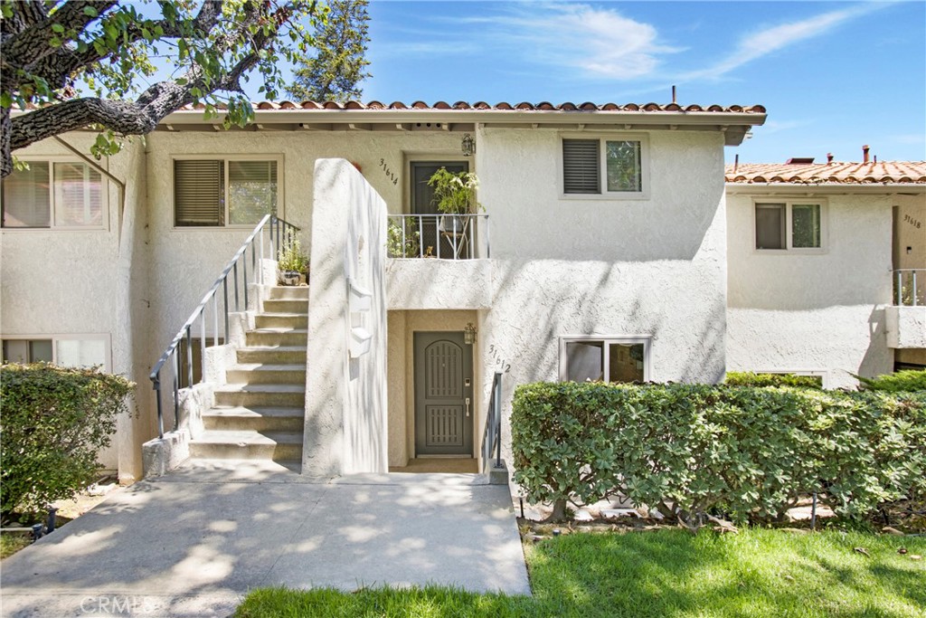 Just off the lush green fairways of El Niguel Country Club lies The West Nine Condominium complex. Within this beautiful haven is a newly remodeled 2 bedroom/2 bath property worthy of the pages of Architectural Digest. New luxury vinyl floors, recessed lighting, high end fixtures & fabulous! 31612 W Nine is a home you can’t easily forget for its incredible upgrades and stylish finishes. New HVAC system that heats & cools like a charm. Kitchen offers quartz counters, built in pull out trash, pots & pans drawers with full custom cabinets. Abundant counter space graces the kitchen that includes a peninsula breakfast bar with storage underneath. Appliances are new as well with Frigidaire Gallery Fridge, 5-burner gas stove & microwave. Maytag dishwasher plus fridge & stackable washer/dryer are included. The carpets, window coverings are newer and bathrooms are upgraded to the 9’s! Primary bathroom boasts walk-in shower surrounded with stylish stone tile and Kohler toilet. Secondary bath includes stylish shower in designer tub reminding you to take a moment and enjoy the ambiance of this beautiful space. Both bedrooms are generous in size with built-ins in closets. Also included is an oversized 2 car garage with shelving and extra storage above. The neighborhood is surrounded in lush, mature landscaping and just out the front door sits a lovely green space with zen fountain. The rear patio walks out onto the secluded green space. This property pretty much checks all the boxes, come see what luxury condominium living looks like.