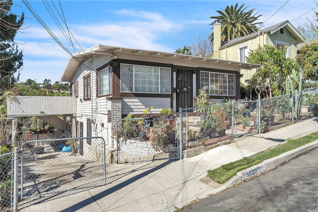 Ideally located near downtown Los Angeles, this exceptional two-story property offers a rare combination of space, versatility, and comfort. Featuring separate entrances for each floor, it’s perfectly suited for multi-generational living, rental income, or customizing to fit your lifestyle. The well-planned layout provides generous living areas filled with natural light, creating a warm and inviting ambiance throughout. Step outside to discover a spacious backyard—an ideal retreat with ample room for gardening, relaxation, or play. The expansive patio is perfect for entertaining, offering a welcoming setting for gatherings with family and friends on warm California evenings. With convenient on-site parking for two vehicles and easy access to the city’s vibrant shopping, dining, and entertainment, this home delivers both flexibility and charm in a prime Los Angeles location.