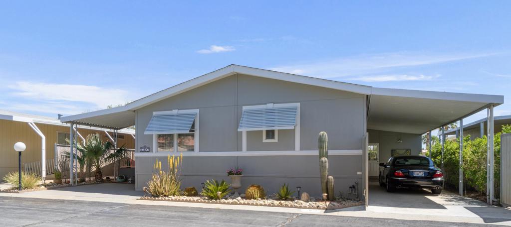 Beautifully Upgraded, Turn Key, fully furnished 3-Bedroom Home in a 55+ Gated Community This charming 3-bedroom, 2-bath home is centrally located within a secure, gated 55+ community and boasts a unique blend of comfort, style, and convenience. Thoughtfully upgraded with quartz countertops in both the kitchen and bathrooms, the home showcases true pride of ownership with tasteful decor, modern updates, and meticulous upkeep throughout. Enjoy added privacy with a gated carport, a handy storage shed, and mature fruit trees. The newly redone deck offers a peaceful view of the park directly across the street -- the perfect spot to relax and unwind. Just steps away from the community park is the clubhouse, where you'll find a variety of amenities including three swimming pools, indoor and outdoor spas, a library, pool tables, and more. One of the most convenient features of this home is its location -- you can walk to the nearby grocery store without even crossing a main road. With easy access to the freeway and just minutes from Palm Springs Airport via Gene Autry Trail, getting around is a breeze. This home is on a permanent foundation and is eligible for all types of financing. Plus, the low HOA fees make it even more attractive. Come see this beautiful home in person -- it's a must-see! Seller's car is included when buyer submits a full price offer, the car is a 2001 Jaguar S Type V6