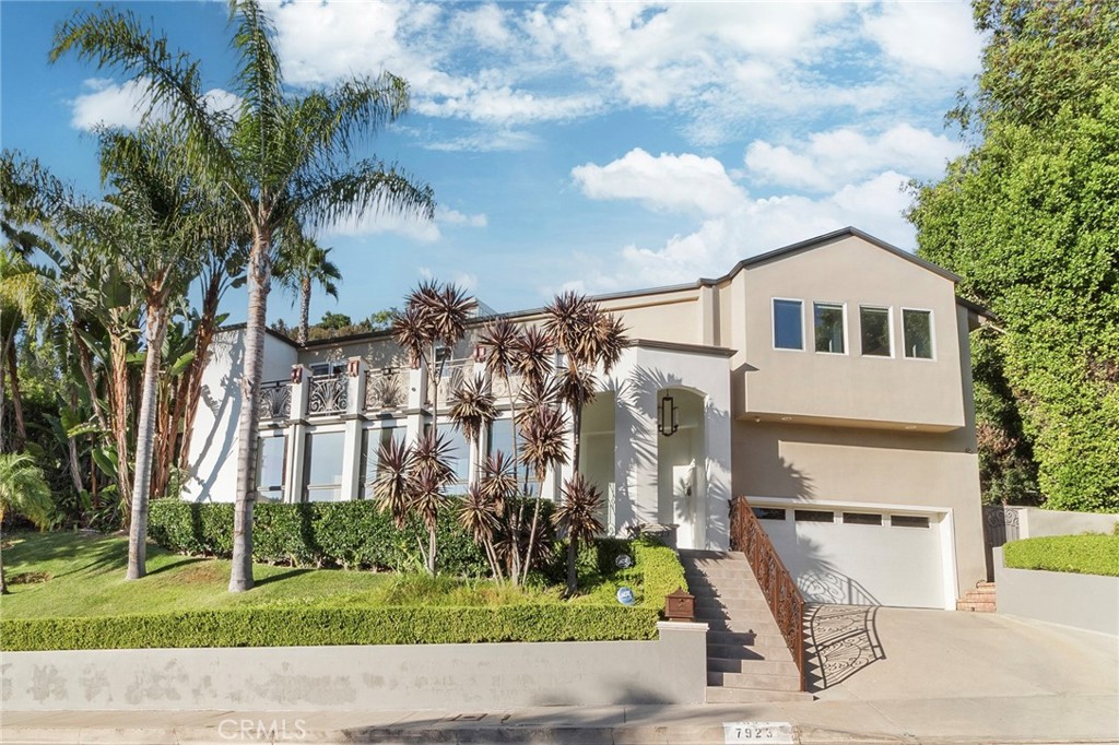 Set on a wide, pedestrian-friendly street with sidewalks, this beautiful residence in the Mt. Olympus area of the Hollywood Hills offers both luxury and a welcoming neighborhood atmosphere. Spanning 0.66 acres and approximately 4,000 sq. ft. of living space, the home features 4 bedrooms and 4.5 bathrooms—with one bedroom currently used as a home office—designed with comfort, privacy, and natural light in mind.
Every room is enhanced by oversized windows, framing magnificent mountain views and seamlessly connecting indoor and outdoor living.
Outdoors, a private swimming pool with a waterfall Jacuzzi creates a serene retreat, while the lush hillside backdrop expands the sense of space and natural beauty.
Just minutes from the Sunset Strip, this home offers both serenity and convenience, making it an ideal haven for those who value privacy while staying close to the vibrant heartbeat of Los Angeles.