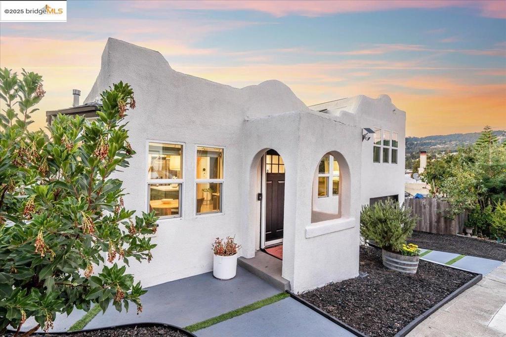 Come and check out this upgraded 1925 home located in Oakland’s desirable Maxwell Park neighborhood. The open concept floor plan features white shaker cabinets, gorgeous quartz countertops, stainless steel appliances, engineered maple floors, and refinished original hardwood upstairs. Bathrooms include a defogging vanity mirror, and towel warmer for a spa-like feel. Enjoy smart home comfort with high efficiency mini splits, Ecobee+ climate control, ceiling fans, a smart fridge, washer, dryer, and Ring alarm system. Energy Efficiency & Electrical: Added 15 owned solar panels which usually offset all house energy costs (not considering EV usage), upgraded electrical panel with 220V outlet, white silicone roofing, and improved attic ventilation. Structural improvements include a redone foundation, basement waterproofing, and a polycuramine glazed garage floor. The landscaped yard offers fruit trees, passionfruit vines, a graywater irrigation system, hot tub, patio, outdoor shower, and two additional outlets. With a finished basement space, new exterior stucco siding, a new fence, and an excellent 81 Walk Score, this home combines modern living, efficiency, and an unbeatable location, a true must see.
