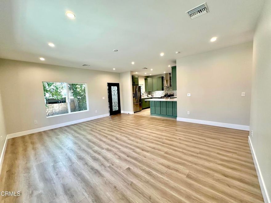 Welcome to this newly built 3-bedroom, 2-bathroom ADU located in one of Granada Hills' most desirable neighborhoods. Thoughtfully designed, the Home offers an open-concept floor plan that connects the living, dining, and kitchen spaces, creating a bright and inviting atmosphere. The kitchen is a true highlight, offering top-of-the-line stainless steel appliances, premium finishes, and unique cabinet color.  Energy efficiency is built in, with solar panels reducing utility costs and promoting sustainable living.  The laundry nook, featuring a brand new washer and a dryer concealed behind the sleek and modern closet doors, offers both style and convenience. The primary bedroom features a walk-in closet and direct access to a cozy patio.Set in a prime location, this property is just moments away from top-rated schools, popular restaurants, lively bars, and convenient shopping centers. With its stylish design, smart layout, and unbeatable location, this home is a perfect fit for families seeking comfort and community in Granada Hills.
