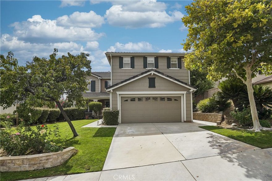 Welcome to this beautifully maintained, original-owner home in the highly desirable HASLEY HILL COMMUNITY. This spacious two-story residence offers over 3,100 sq. ft. of living space with 5 generously sized bedrooms, 3 full bathrooms, and an oversized upstairs bonus room (appx. 400 sq. ft.), perfect for a media room, game room, or home office. A convenient downstairs bedroom with adjacent full bath makes this home ideal for guests or multi-generational living. As the largest model floorplan, the home was thoughtfully designed for comfort, style, and everyday living, all nestled in a quiet and picturesque neighborhood. Enter through impressive double doors into an open and inviting layout filled with natural light from numerous windows, adorned with plantation shutters, some featuring split-tilt privacy control. The formal living and dining rooms flow seamlessly into the expansive family room with a cozy fireplace and builder-installed pre-wiring for surround sound (system not installed). The spacious kitchen boasts Corian countertops, abundant maple cabinetry, breakfast bar, pantry, and a large breakfast area overlooking the backyard. The soaring cathedral ceiling showcases a beautiful staircase with wood handrails, including a landing pad that elegantly splits the staircase, leading to a large upstairs landing that connects to each bedroom. Retreat to the expansive primary suite offering breathtaking valley and mountain views, a spa-like bathroom with dual sinks, soaking jet tub, separate walk-in shower, private water closet, and a huge walk-in closet with dual entry. Three large junior bedrooms each features deep closets with dual floor-to-ceiling mirrored doors for ample storage. Additional highlights include a dual-zone A/C system, ceiling fans, crown molding, rain gutters, and fresh interior paint (completed 4 months ago). The private backyard is an entertainer’s paradise with a covered patio, paved hardscape, iron fencing, pre-plumbed electrical outlets, fruit trees, and stunning mountain and valley views—perfect for relaxing evenings or lively gatherings. Other features include an interior laundry room with storage, remote-controlled bidets, owned water softener, reverse osmosis water filtration at the kitchen sink, and a large attached 2-car garage with cabinetry. The exterior was painted appx. 5 years ago. Conveniently located near shopping, dining, freeway access, Castaic Lake, and Six Flags Magic Mountain. Low HOA and NO Mello Roos! Welcome...
