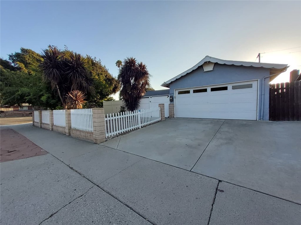 Discover this airy 3-bedroom, 2-bath home featuring an extra spacious room and versatile den/office, perfect for working from home, a playroom, or a creative studio. Situated on an approximately 6,952 sqft lot near the Montalvo neighborhood and just minutes from the Government Center off Ralston.
The open floor plan connects the kitchen, dining area, and living room with fireplace, enhanced by abundant natural light. The private front yard, enclosed with vinyl fencing for privacy, is ideal for outdoor entertaining or gardening. Additional highlights include garden areas with white picket fencing and mature fruit trees: guava, lime, apple, and pomegranate.
A large backyard with patio, wide street frontage, and a generous driveway with extra parking. Conveniently located near Ventura’s beaches, harbor, parks, golf courses, schools, shopping, dining, and freeway access.