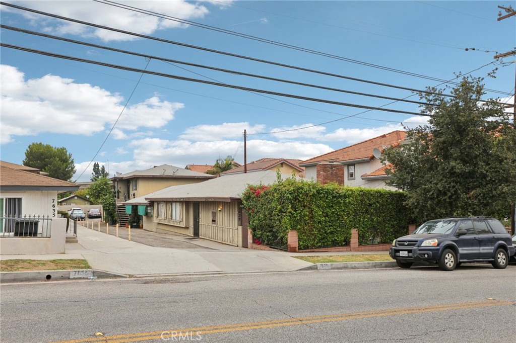 7639 Hellman Ave is a 4,054 sq ft quadruplex on a 10,015 sq ft lot, featuring three 2-bed/1-bath units and one 3-bed/2-bath unit. All units are tenant-occupied, providing immediate rental income. Conveniently located near shopping, dining, and transportation. Showings are drive-by only; offers subject to interior inspection.