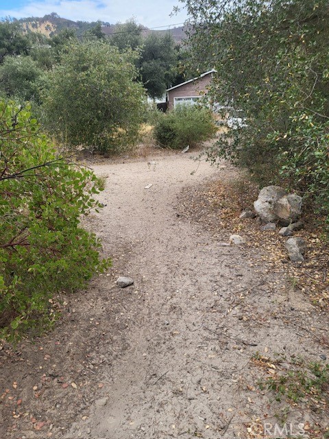 Flat city lot close to Clearlake and major shopping. Paved road with nice neighboring homes.